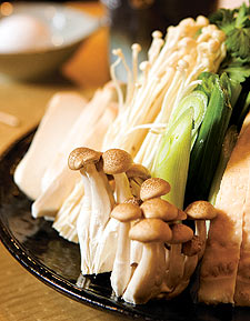Veggies and mushrooms wait for their chance to shine in Chiyo's hot pot masterpiece: sukiyaki.
